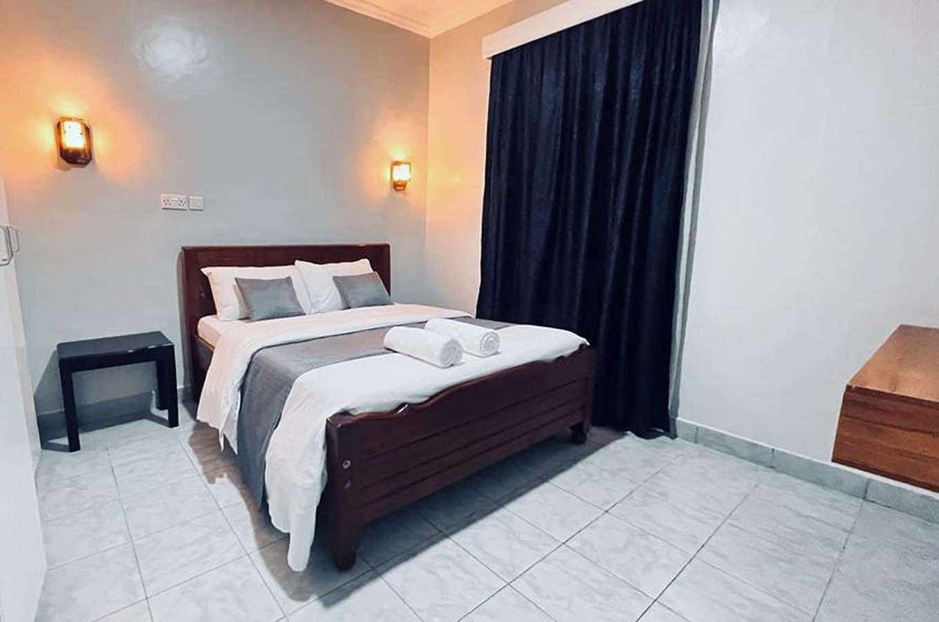 Standard room bed made up with clean white towels