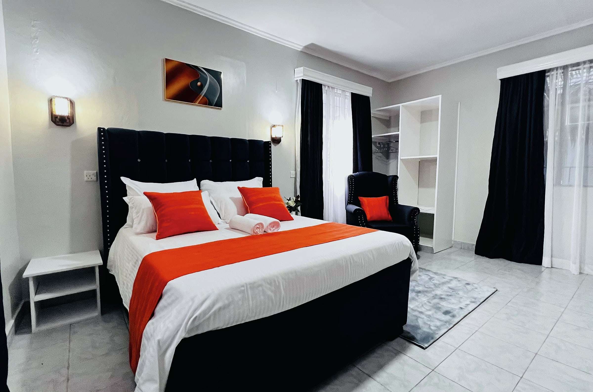 VIP room with armchair, rug and built-in wardrobe